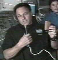  Col Ilan Ramon holds the Tiny Torah he carried into space. 